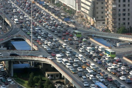 A traffic jam is seen during the rush hour in Beijing June 14, 2006. China needs to improve public transport to help curb choking traffic jams instead of building more and more highways to make room for private cars, the World Bank said on Wednesday. REUTERS/ Jason Lee (CHINA)